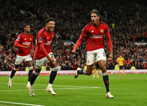 Raphael Varane, Jadon Sancho og Marcus Rashford jubler