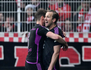 Harry Kane jubler efter sin frisparksscoring mod Union Berlin