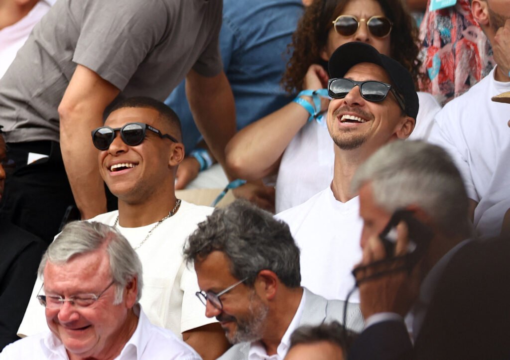 Tennis - French Open - Roland Garros, Paris, France - June 11, 2023 Paris St Germain's Kylian Mbappe and former footballer Zlatan Ibrahimovic are pictured in the stands during the men's singles final between Serbia's Novak Djokovic and Norway's Casper Ruud