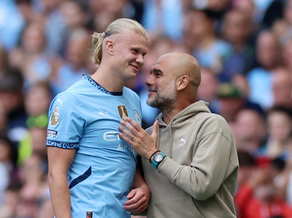 Soccer Football - Premier League - Manchester City v Ipswich Town - Etihad Stadium, Manchester, Britain - August 24, 2024 Manchester City manager Pep Guardiola reacts with Erling Haaland after he was substituted REUTERS/Phil Noble EDITORIAL USE ONLY.NO USE WITH UNAUTHORIZED AUDIO, VIDEO, DATA, FIXTURE LISTS, CLUB/LEAGUE LOGOS OR 'LIVE' SERVICES. ONLINE IN-MATCH USE LIMITED TO 120 IMAGES, NO VIDEO EMULATION.NO USE IN BETTING, GAMES OR SINGLE CLUB/LEAGUE/PLAYER PUBLICATIONS. PLEASE CONTACT YOUR ACCOUNT REPRESENTATIVE FOR FURTHER DETAILS.. TPX IMAGES OF THE DAY