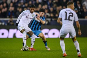 Marcus Rashford i duel med Kyriani Sabbe i Champions League.