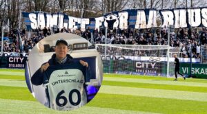AGF fans med banner + Thomas Unterschlag der holder en trøje.