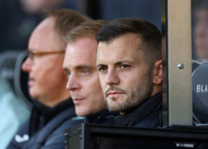 Jack Wilshere på Norwich' trænerbænk.