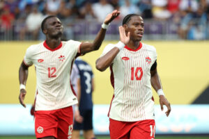 Jonathan David jubler efter en scoring for Canada.