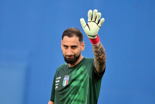 (FILES) Italys goalkeeper #01 Gianluigi Donnarumma waves during the warm up before the 2026 World Cup qualifiers Europe zone group I football match between Italy and Moldova at the Mapei Stadium in Reggio Emilia, on June 9, 2025. PSGs Italian goalkeeper Gianluigi Donnarumma is not included in the team that will play the UEFA Super Cup against Tottenham in Udine on August 13, 2025, where Frencg goalkeeper Lucas Chevalier is expected to take his place, according to the lineup announced by the club on Tuesday. (Photo by Alberto PIZZOLI / AFP)