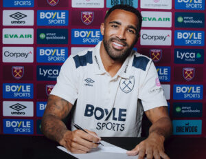 Wilson underskriver kontrakt