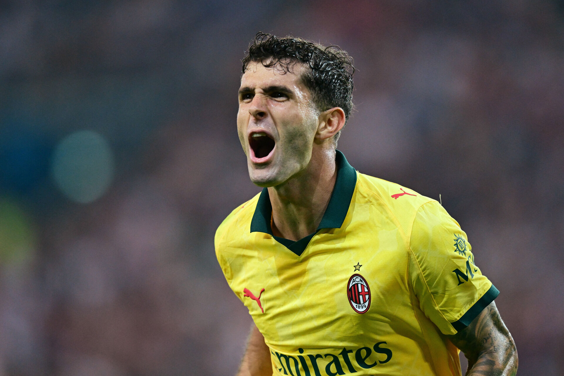 Christian Pulisic jubler efter en scoring for AC Milan mod Udinese.
