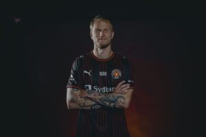 Magnus Jensen med armene over kors