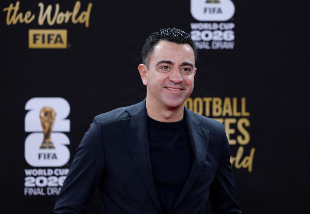 Xavi med et smil på under lodtrækningen til VM.